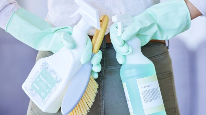 product_brush_and_woman_back_with_cleaning_servi_2025_04_06_10_57